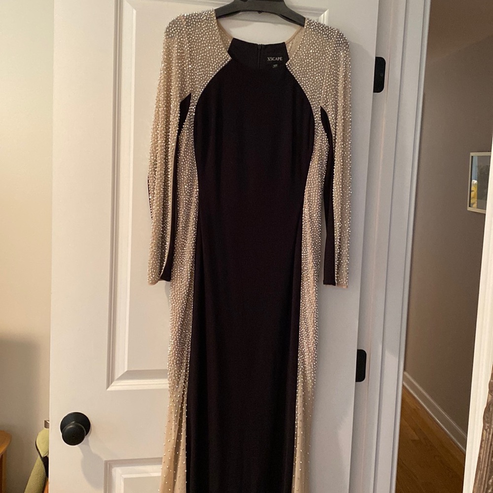 Black maxi evening dress with mesh and beading side panels. I an 5’7”